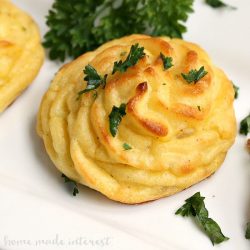 Thanksgiving sides duchess potatoes on a white plate