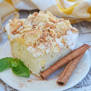 This Eggnog Poke Cake recipe is an easy pudding poke cake made with box cake mix and instant vanilla pudding, with delicious eggnog flavor. #pokecakerecipe #puddingpokecake #eggnogrecipes www.savoryexperiments.com