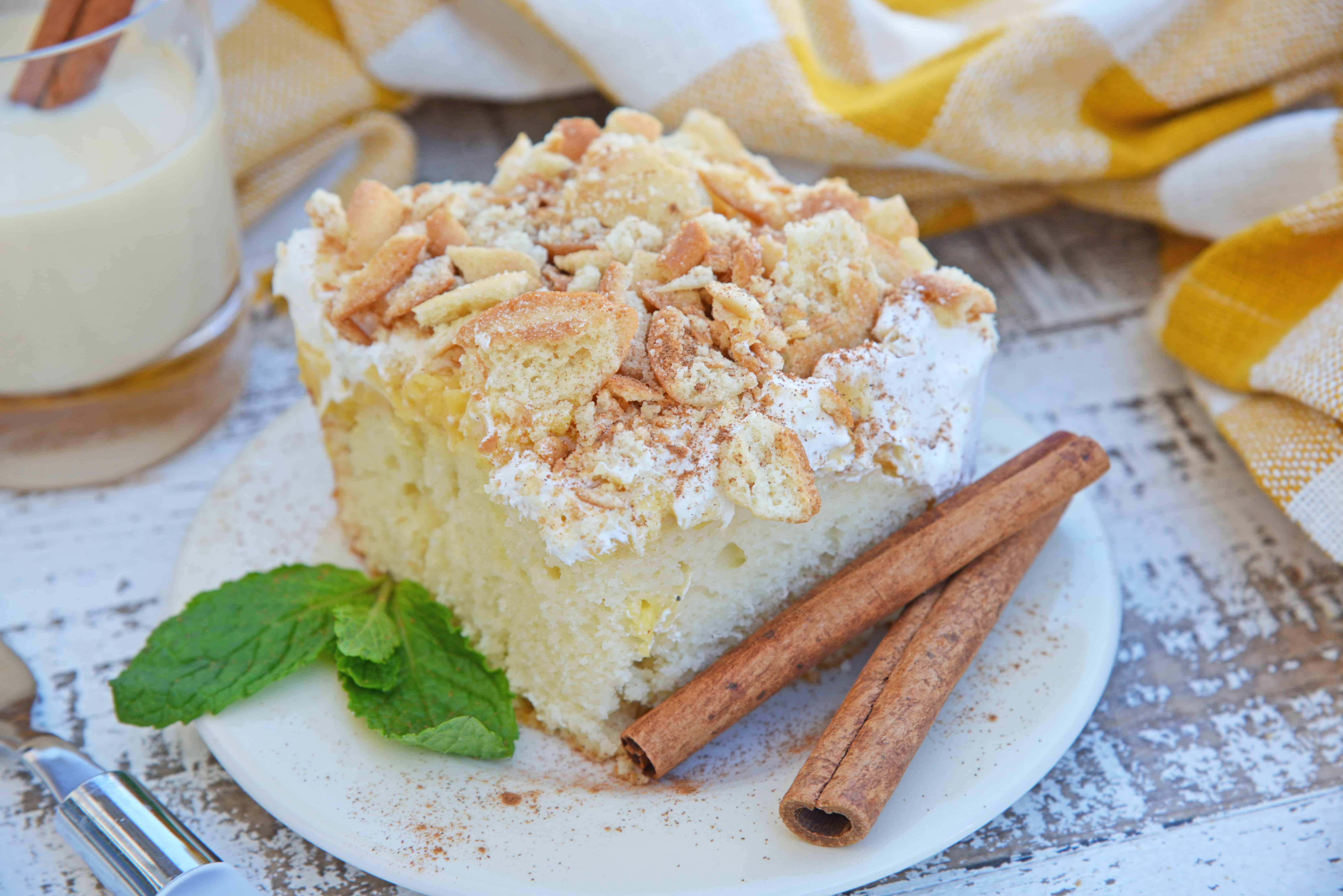 This Eggnog Poke Cake recipe is an easy pudding poke cake made with box cake mix and instant vanilla pudding, with delicious eggnog flavor. #pokecakerecipe #puddingpokecake #eggnogrecipes www.savoryexperiments.com