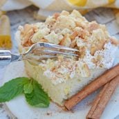 This Eggnog Poke Cake recipe is an easy pudding poke cake made with box cake mix and instant vanilla pudding, with delicious eggnog flavor. #pokecakerecipe #puddingpokecake #eggnogrecipes www.savoryexperiments.com