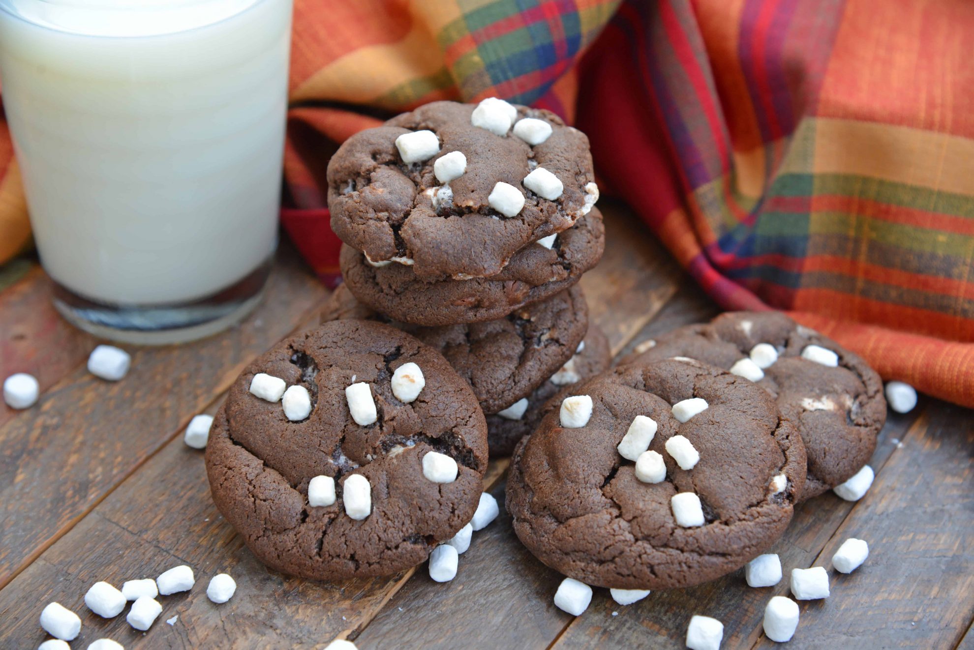 Hot Chocolate Cookies are must-make Christmas cookies! A favorite chocolate sugar cookie recipe with marshmallows, you'll never be able to eat just one! #hotchocolatecookies #chocolatesugarcookiesrecipe #christmascookies www.savoryexperiments.com