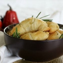 Thanksgiving sides rosemary crescent rolls in a black bowl