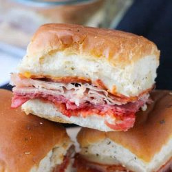 Italian slider sandwich recipes stacked on a cutting board