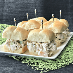 Turkey salad sliders on a white plate, leftover turkey recipes