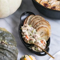 Turkey pot pie in a black dish - leftover turkey recipes