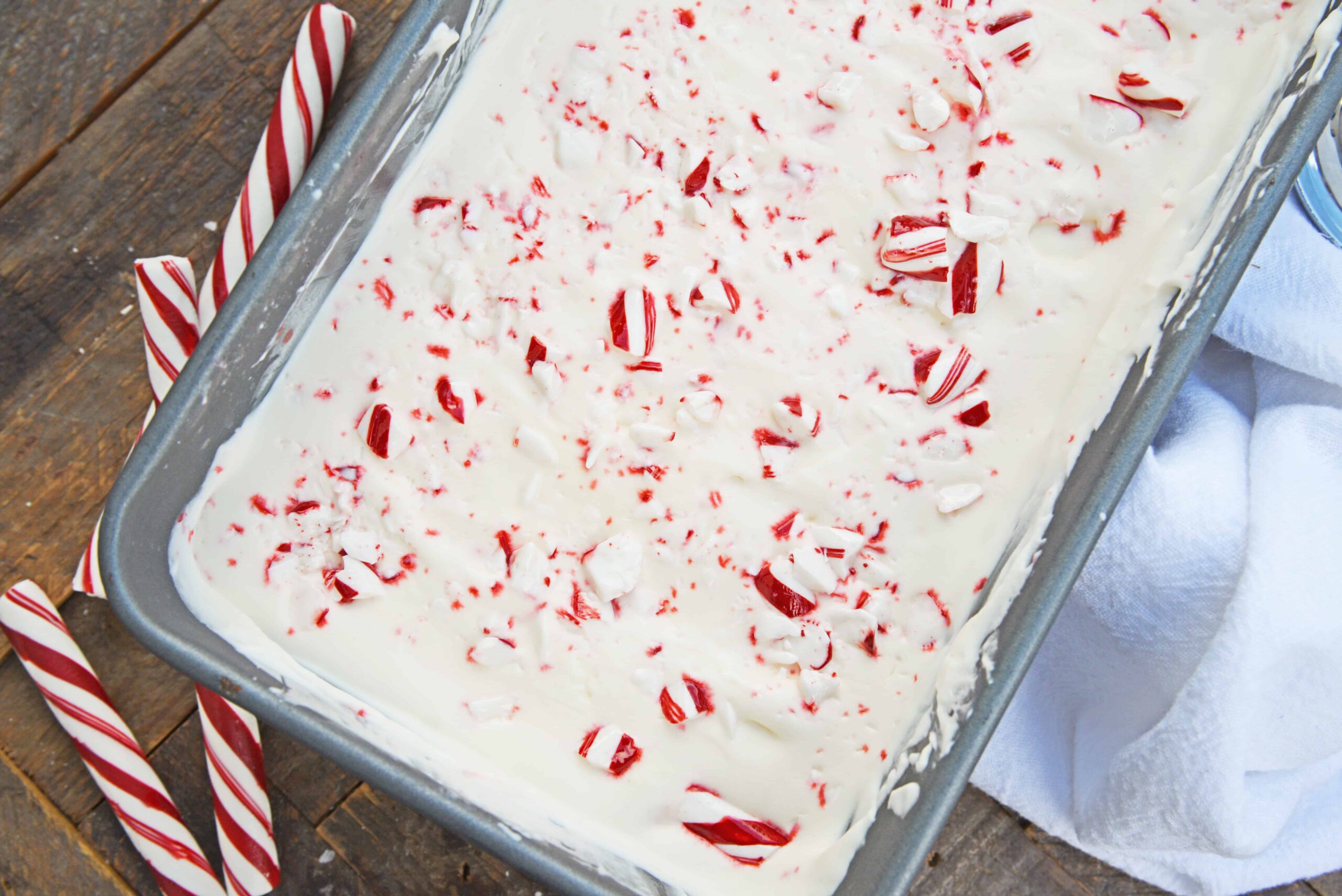 No-Churn Peppermint Ice Cream is an easy homemade ice cream recipe made with just 5 ingredients. No ice cream maker required! Perfect for the holidays. #candycaneicecream #nochurnicecream #homemadeicecreamrecipes www.savoryexperiments.com