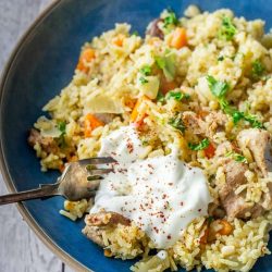 Turkey pilaf in a blue bowl - leftover turkey recipes