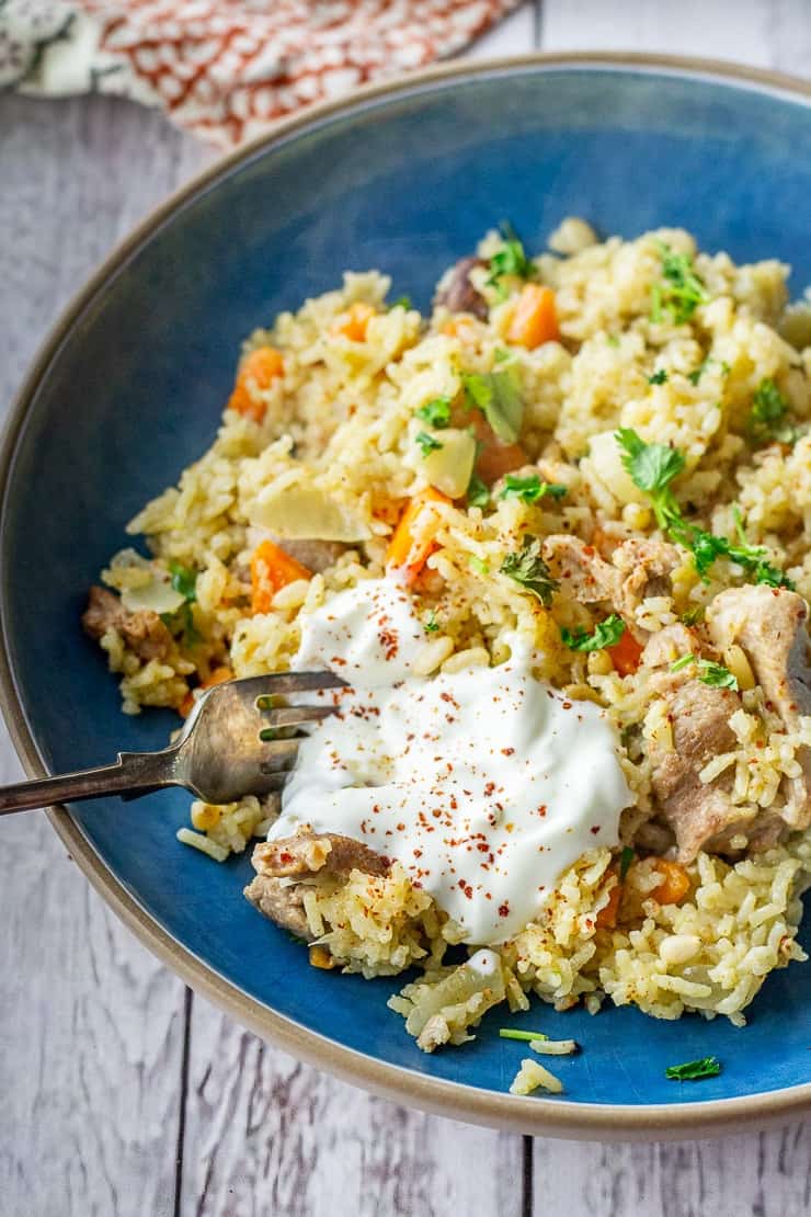 Turkey pilaf in a blue bowl - leftover turkey recipes