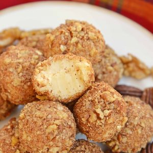 White Chocolate Truffles are an easy truffle recipe made with just a handful of ingredients. Creamy white chocolate rolled in toasted pecans, cinnamon and nutmeg. #whitechocolatetruffles #easytrufflerecipe www.savoryexperiments.com