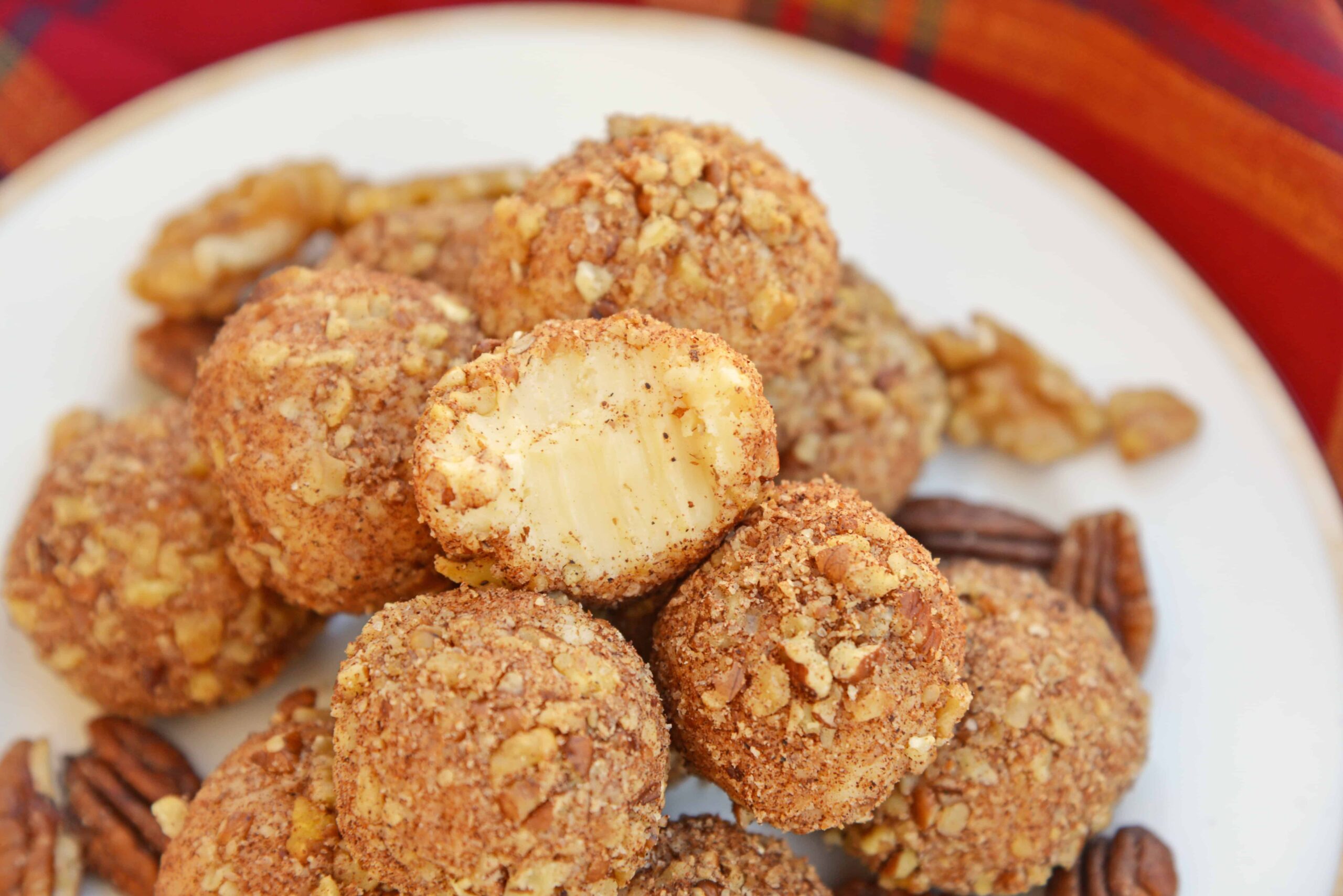 White Chocolate Truffles are an easy truffle recipe made with just a handful of ingredients. Creamy white chocolate rolled in toasted pecans, cinnamon and nutmeg. #whitechocolatetruffles #easytrufflerecipe www.savoryexperiments.com