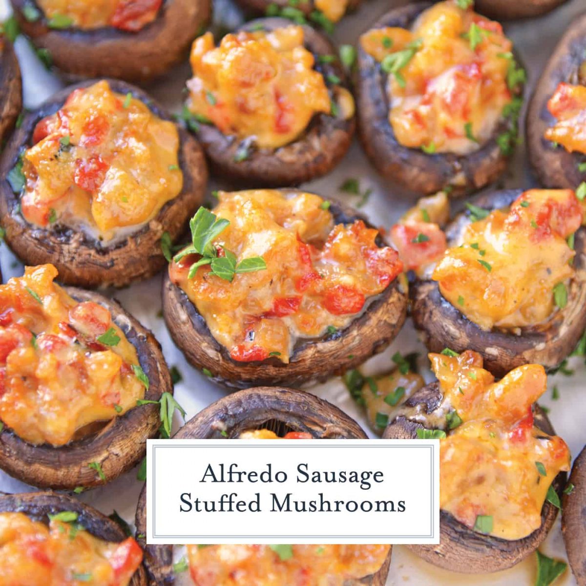 Alfredo Sausage Stuffed Mushrooms are an easy appetizer that's perfect for holiday parties. Everyone will love these stuffed mushrooms with sausage! #sausagestuffedmushrooms #stuffedmushrooms www.savoryexperiments.com