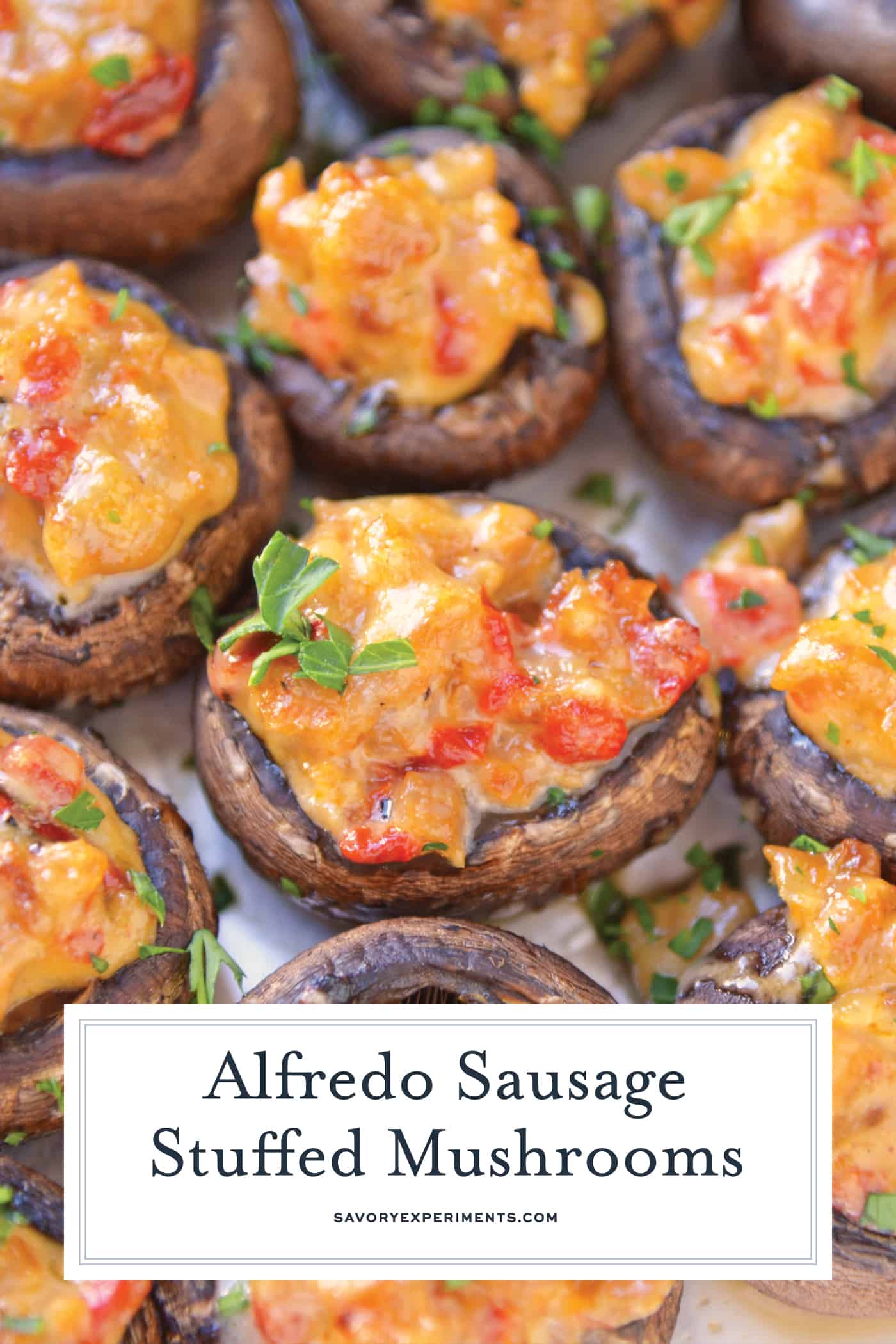 Alfredo Sausage Stuffed Mushrooms are an easy appetizer that's perfect for holiday parties. Everyone will love these stuffed mushrooms with sausage! #sausagestuffedmushrooms #stuffedmushrooms www.savoryexperiments.com