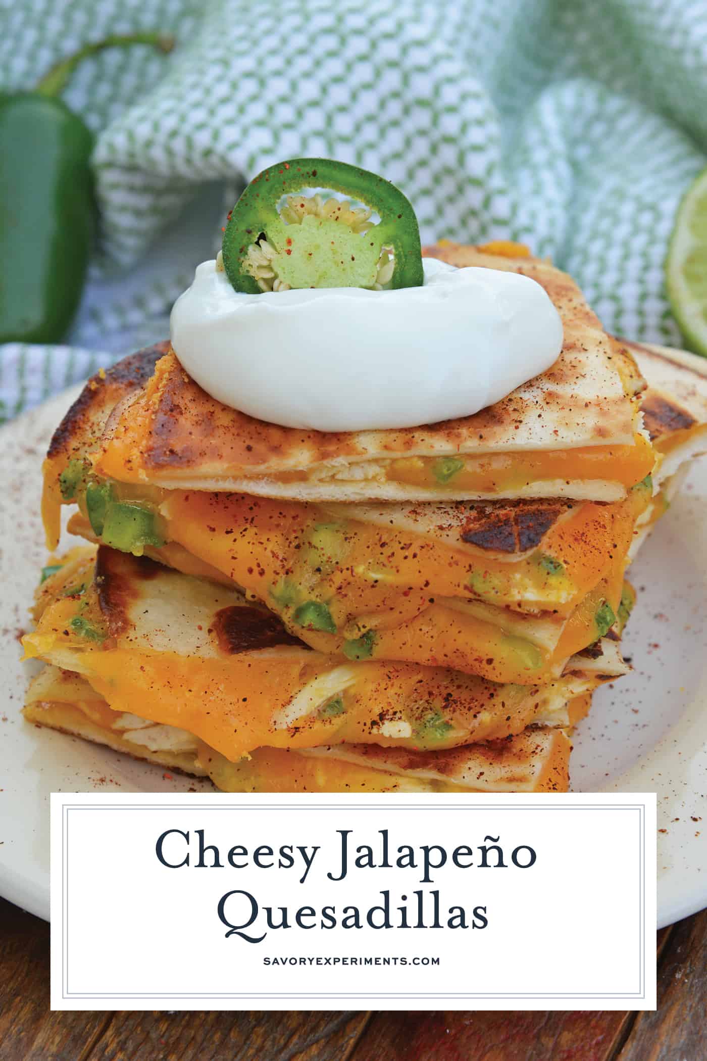 Cheesy, spicy and shareable Cheesy Jalapeño Quesadillas are the gooey appetizer everyone loves. Stacked with cheddar cheese, fresh jalapeños and shredded chicken, they are ready in just 10 minutes! #cheesequesadillas www.savoryexperiments.com