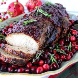 angled shot of sliced herbed balsamic pork roast