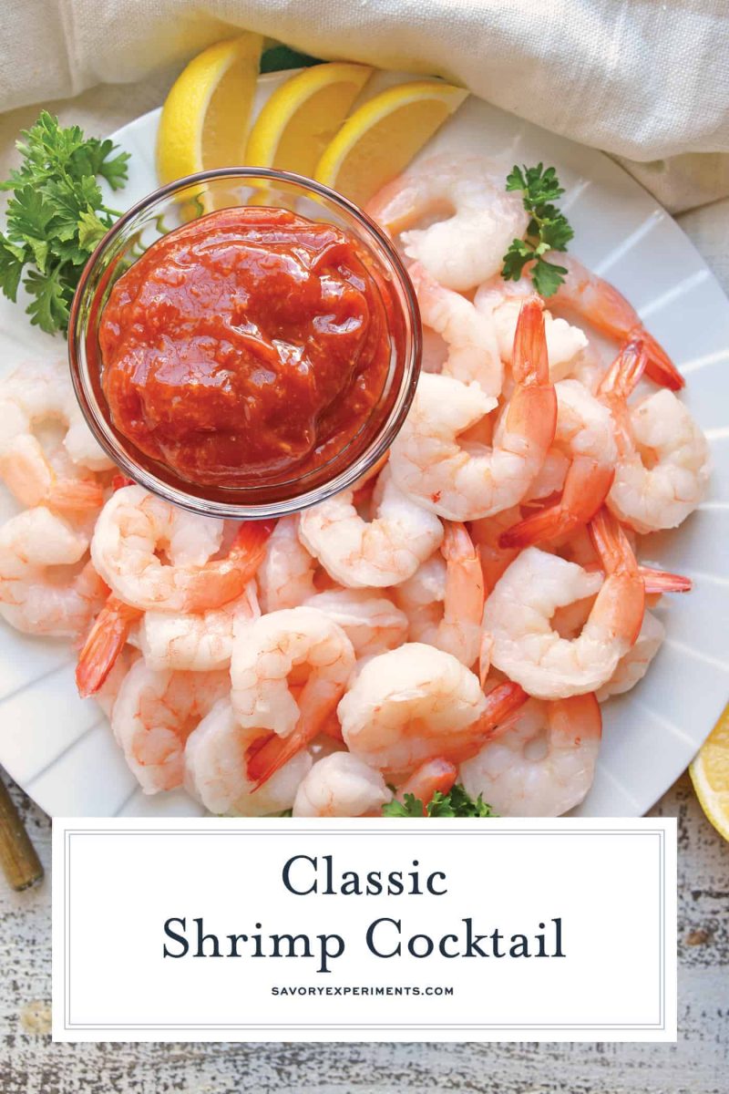 overhead close up with text overlay of shrimp cocktail with sauce and lemons 