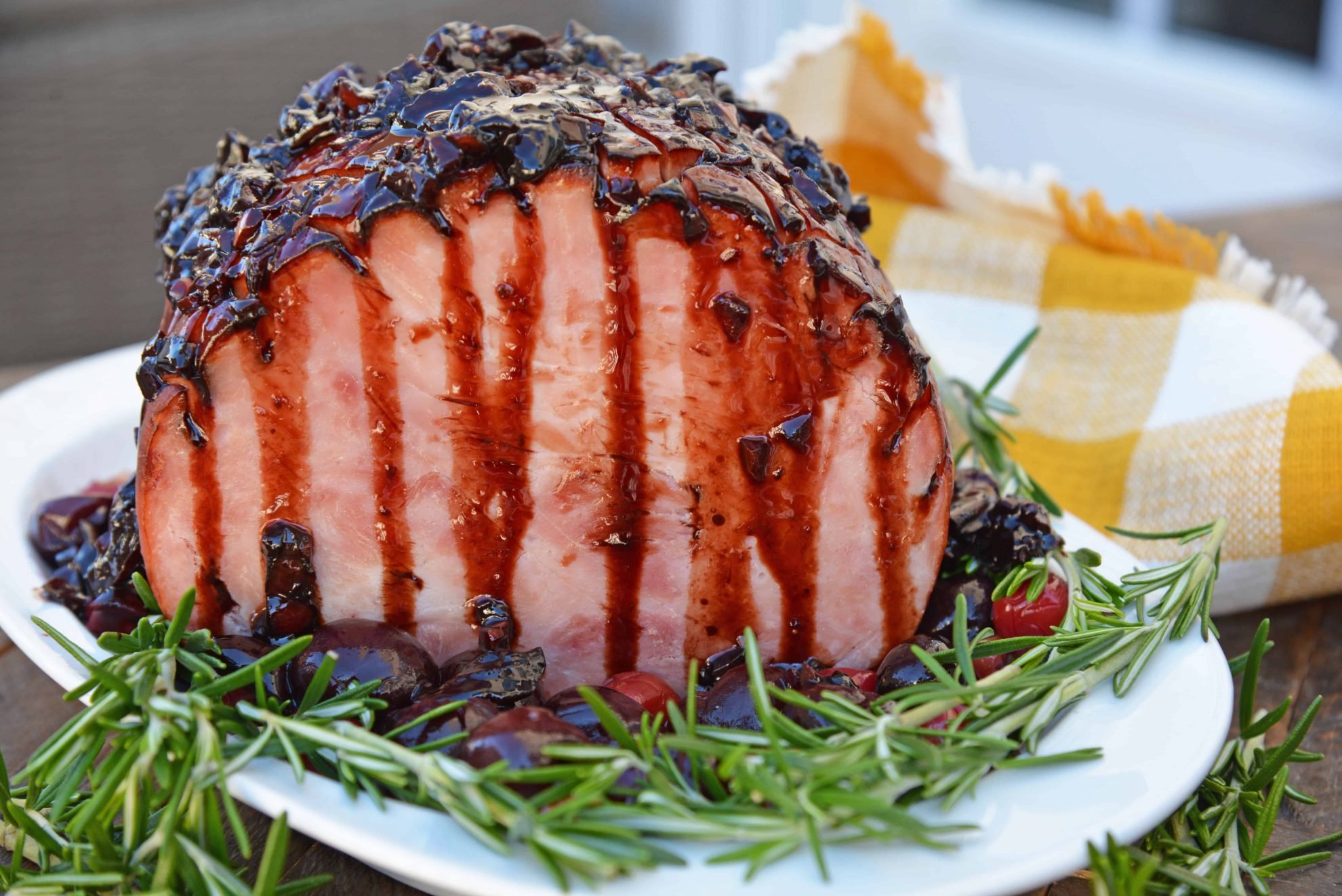 Balsamic Cherry Ham Glaze is an easy ham glaze for your Christmas ham or any baked ham throughout the year. Tart cherries, balsamic vinegar and brown sugar lend bold flavors. #hamglaze #christmasham #hamrecipe www.savoryexperiments.com 