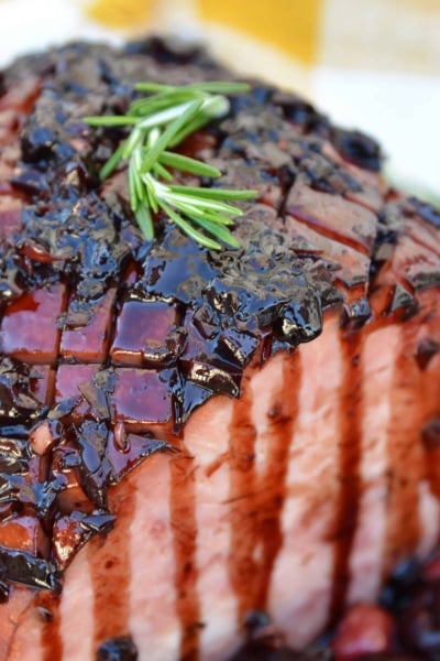 Balsamic Cherry Ham Glaze is an easy ham glaze for your Christmas ham or any baked ham throughout the year. Tart cherries, balsamic vinegar and brown sugar lend bold flavors. #hamglaze #christmasham #hamrecipe www.savoryexperiments.com