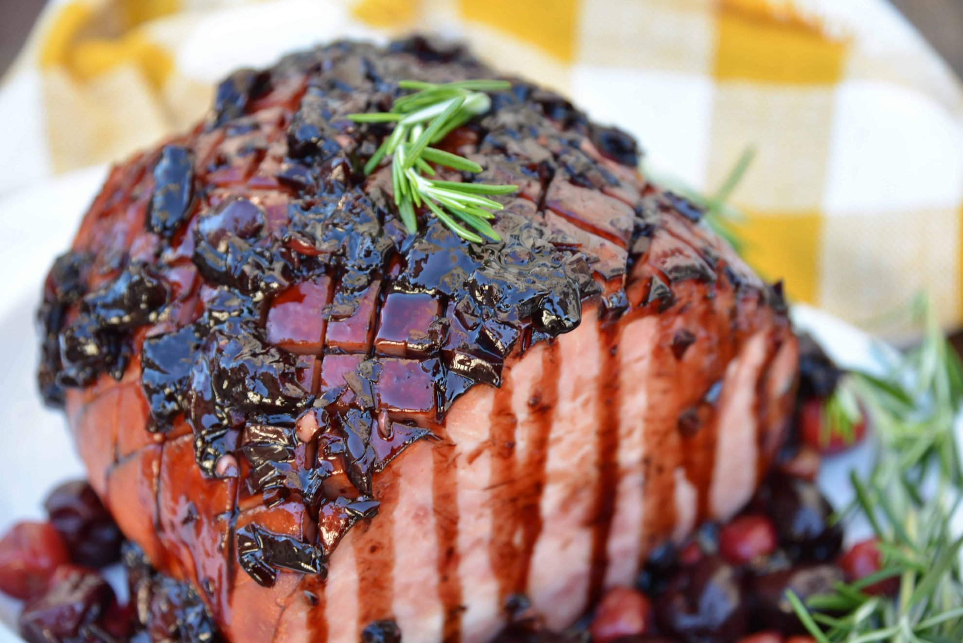 Balsamic Cherry Ham Glaze is an easy ham glaze for your Christmas ham or any baked ham throughout the year. Tart cherries, balsamic vinegar and brown sugar lend bold flavors. #hamglaze #christmasham #hamrecipe www.savoryexperiments.com