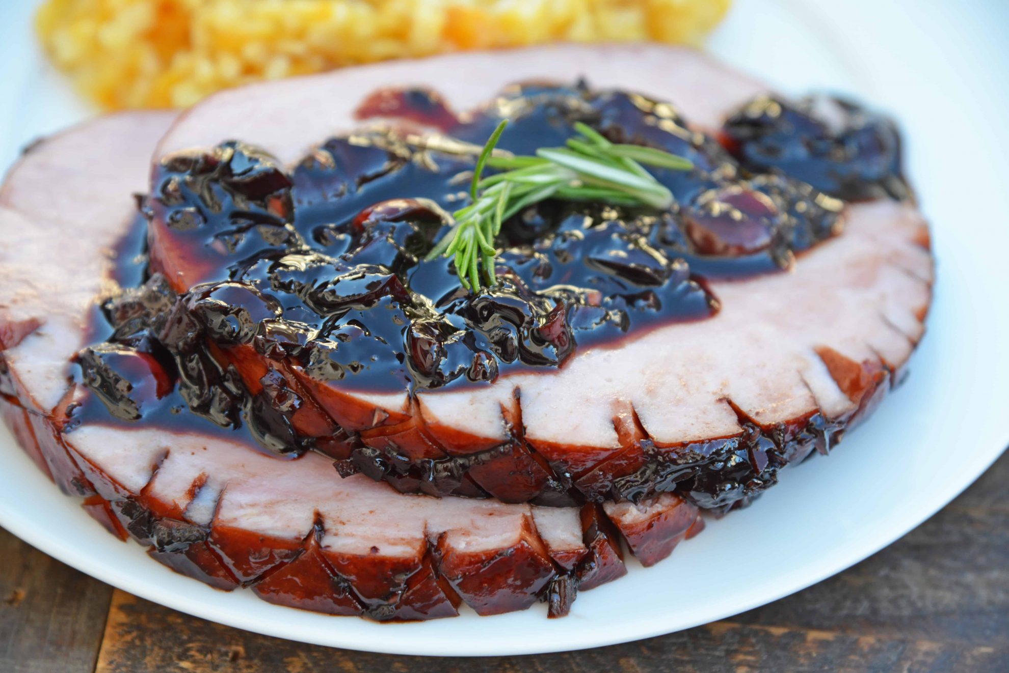 Balsamic Cherry Ham Glaze is an easy ham glaze for your Christmas ham or any baked ham throughout the year. Tart cherries, balsamic vinegar and brown sugar lend bold flavors. #hamglaze #christmasham #hamrecipe www.savoryexperiments.com 