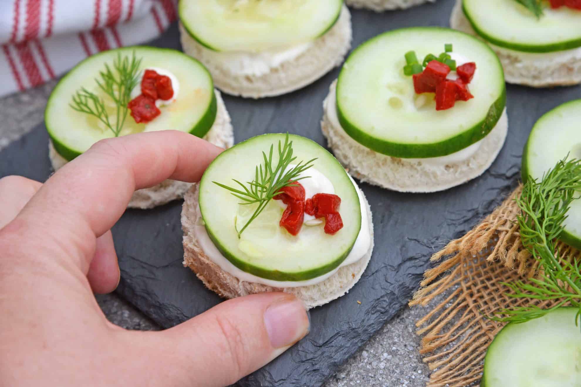 These Cucumber Sandwiches, or cucumber canapes, are easy tea sandwiches that are perfect for any get-together, including holiday parties. #cucumbersandwiches #cucumbercanapes #teasandwiches www.savoryexperiments.com