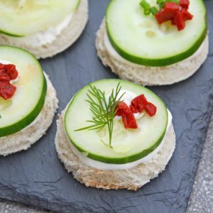 These Cucumber Sandwiches, or cucumber canapes, are easy tea sandwiches that are perfect for any get-together, including holiday parties. #cucumbersandwiches #cucumbercanapes #teasandwiches www.savoryexperiments.com