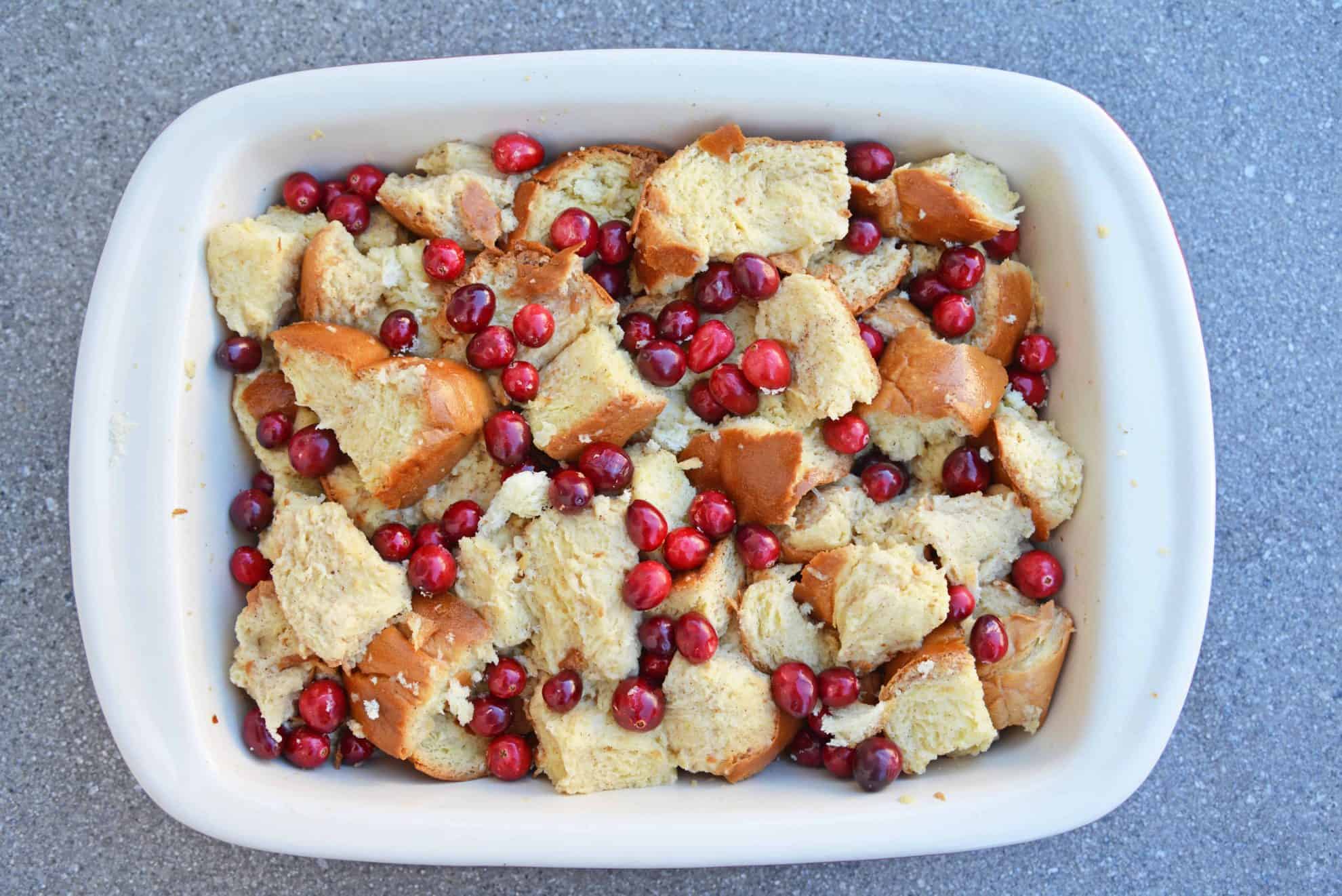Cranberry French Toast Casserole is one of the best recipes using cranberries you'll ever make! A French toast casserole perfect for Christmas breakfast! #frenchtoastcasserole #christmasbreakfast #recipesthatusecranberries www.savoryexperiments.com