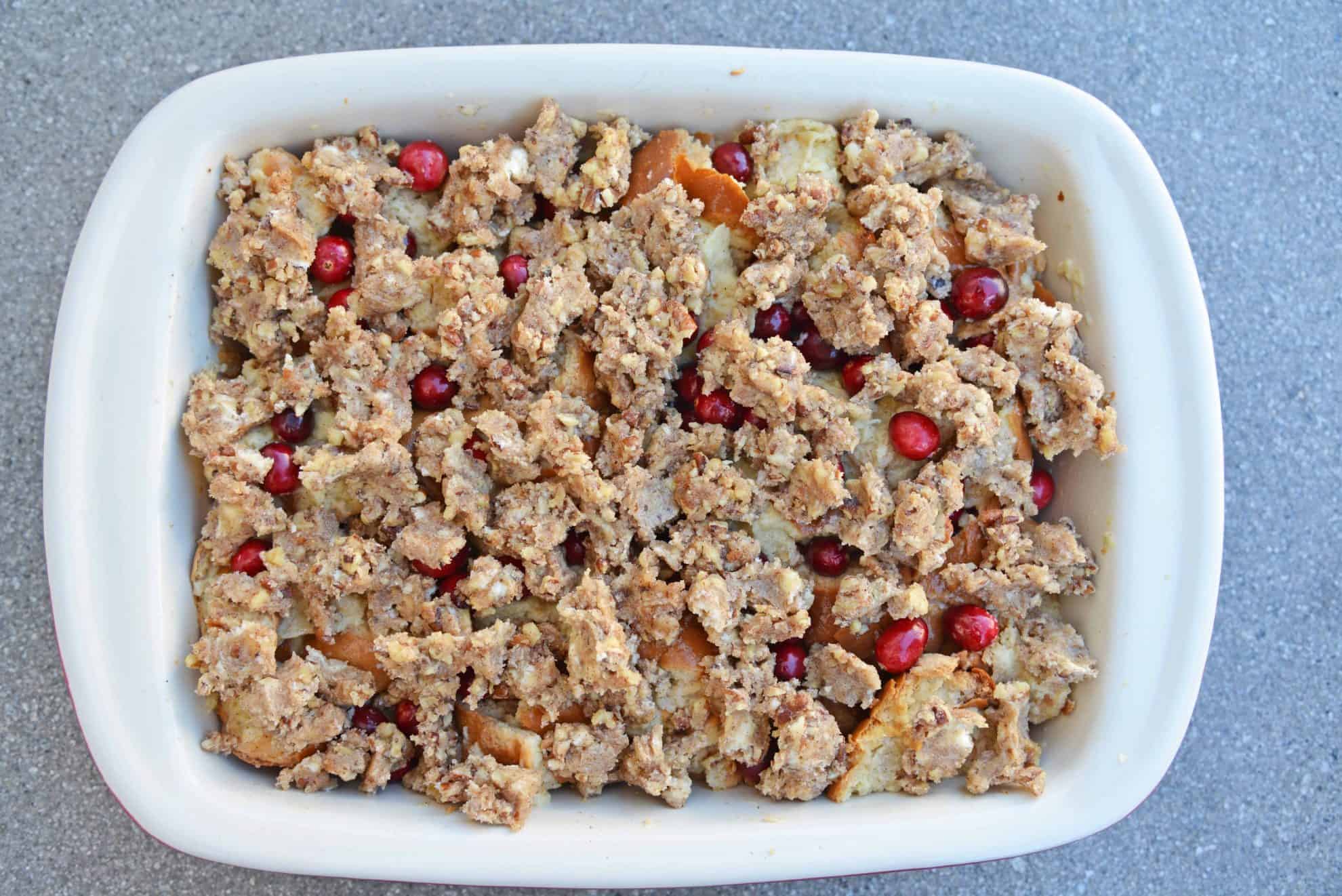 Cranberry French Toast Casserole is one of the best recipes using cranberries you'll ever make! A French toast casserole perfect for Christmas breakfast! #frenchtoastcasserole #christmasbreakfast #recipesthatusecranberries www.savoryexperiments.com