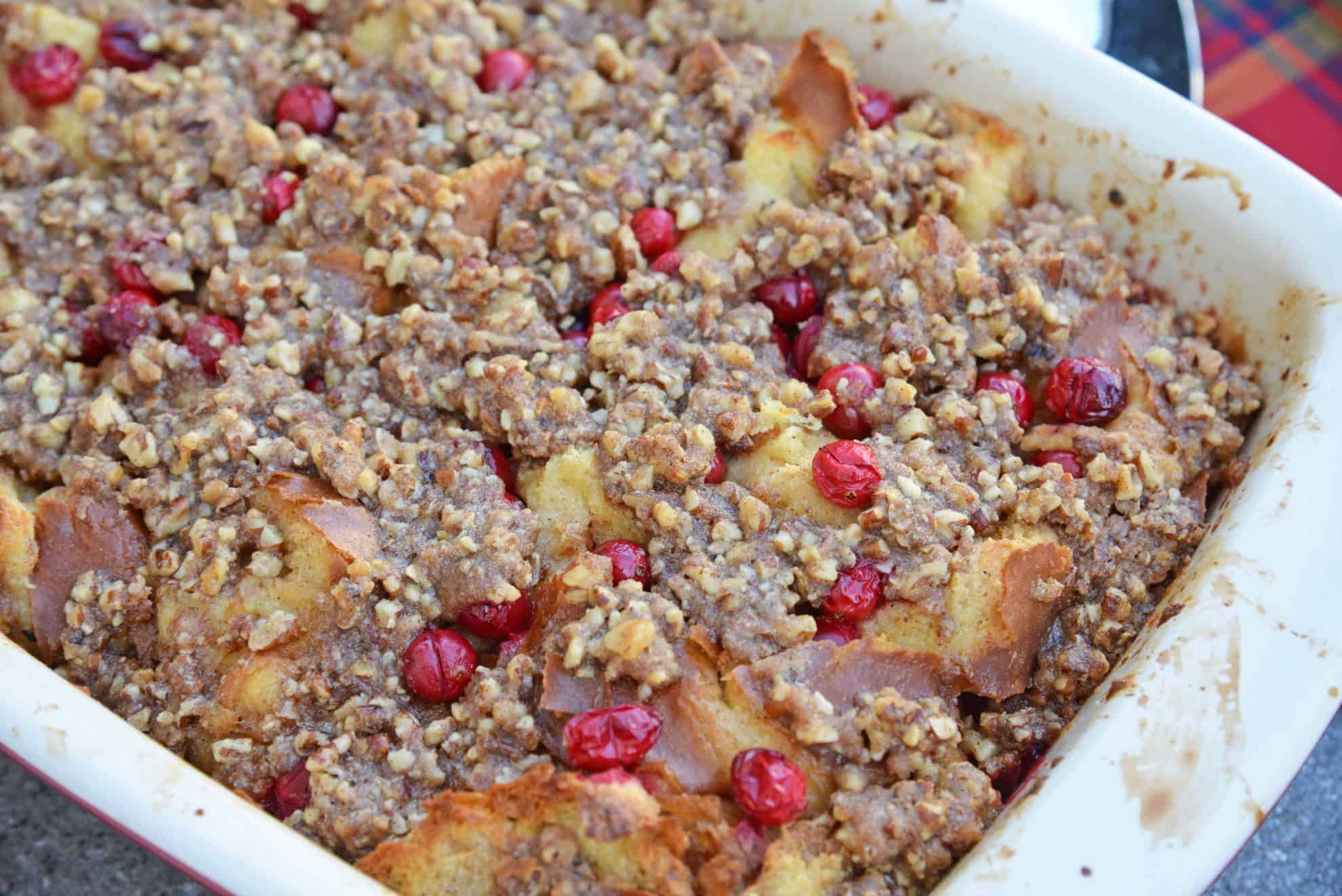 Cranberry French Toast Casserole is one of the best recipes using cranberries you'll ever make! A French toast casserole perfect for Christmas breakfast! #frenchtoastcasserole #christmasbreakfast #recipesthatusecranberries www.savoryexperiments.com