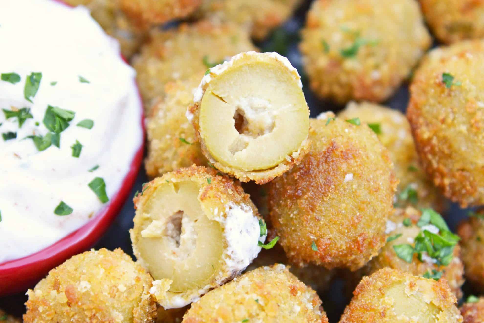 Fried Blue Cheese Stuffed Olives will become your favorite New Year's Eve recipe. But, this easy appetizer recipe is perfect for all occasions! #newyearseverecipes #easyappetizerrecipes #oliverecipes www.savoryexperiments.com