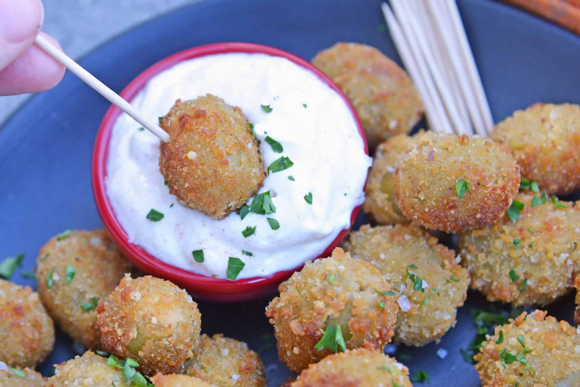 Fried Blue Cheese Stuffed Olives will become your favorite New Year's Eve recipe. But, this easy appetizer recipe is perfect for all occasions! #newyearseverecipes #easyappetizerrecipes #oliverecipes www.savoryexperiments.com