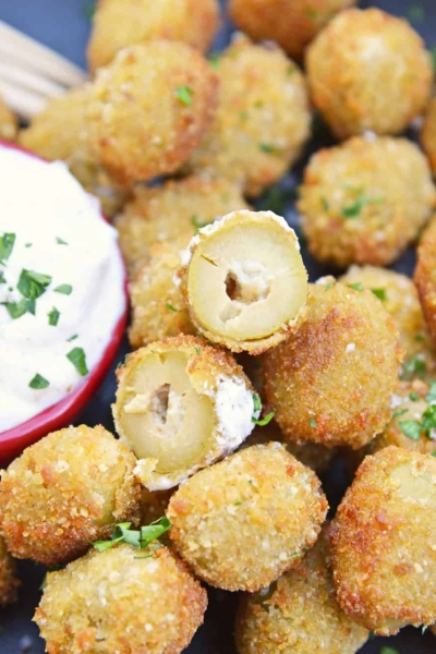 Fried Blue Cheese Stuffed Olives will become your favorite New Year's Eve recipe. But, this easy appetizer recipe is perfect for all occasions! #newyearseverecipes #easyappetizerrecipes #oliverecipes www.savoryexperiments.com