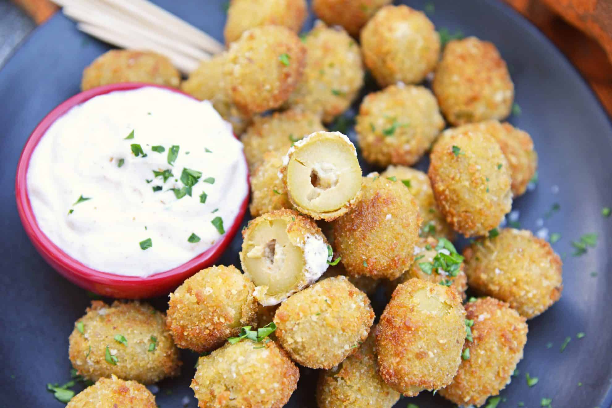 Fried Blue Cheese Stuffed Olives will become your favorite New Year's Eve recipe. But, this easy appetizer recipe is perfect for all occasions! #newyearseverecipes #easyappetizerrecipes #oliverecipes www.savoryexperiments.com