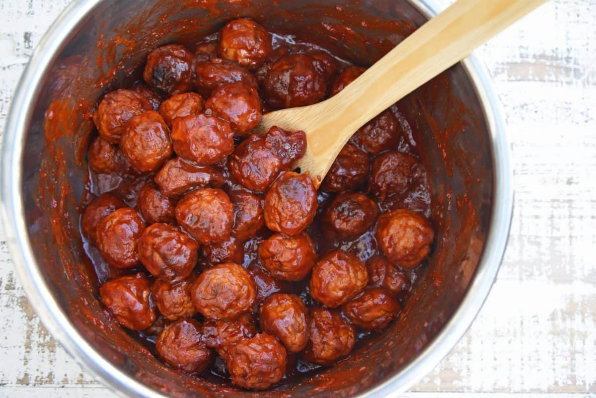 These Cranberry Chili Meatballs, made with only 4 ingredients, will become your go-to cocktail meatballs recipe! The perfect appetizer for any gathering! #partymeatballs #instantpotmeatballs #cocktailmeatballs www.savoryexperiments.com