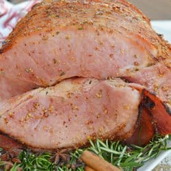 Mustard Brown Sugar Baked Ham is a ham glaze recipe that's perfect for a Christmas ham or an Easter ham. One of the best easy ham recipes! #hamglazerecipe #spiralhamrecipes #easterham #christmasham www.savoryexperiments.com
