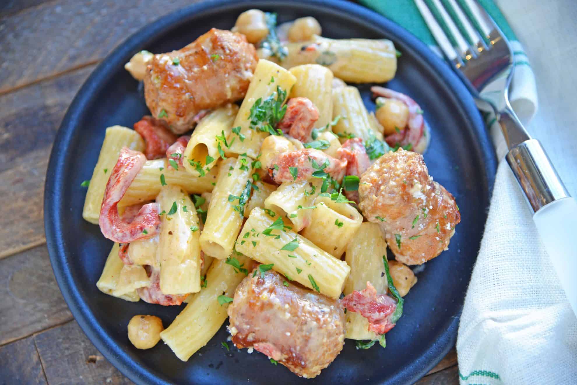 This delicious One-Pan Sausage Alfredo Pasta is an easy weeknight meal with instructions on how to make homemade alfredo sauce. So simple and good! #alfredosauce #alfredopasta www.savoryexperiments.com 
