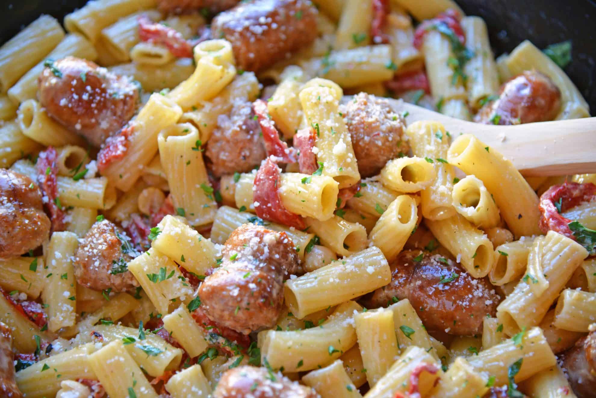 This delicious One-Pan Sausage Alfredo Pasta is an easy weeknight meal with instructions on how to make homemade alfredo sauce. So simple and good! #alfredosauce #alfredopasta www.savoryexperiments.com 