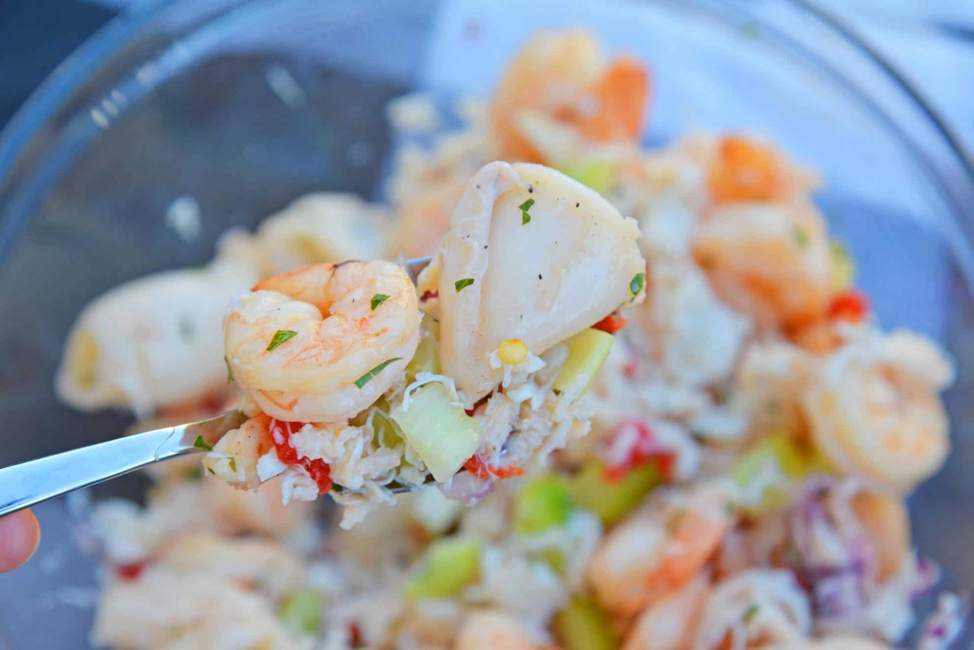 This Italian Seafood Salad, made with shrimp, calamari and lump crab meat, is one of the best and easiest seafood salad recipes you'll ever try.  #seafoodsalad #italianseafoodsalad www.savoryexperiments.com