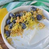 bowl of yogurt with blueberries, lemon and granola