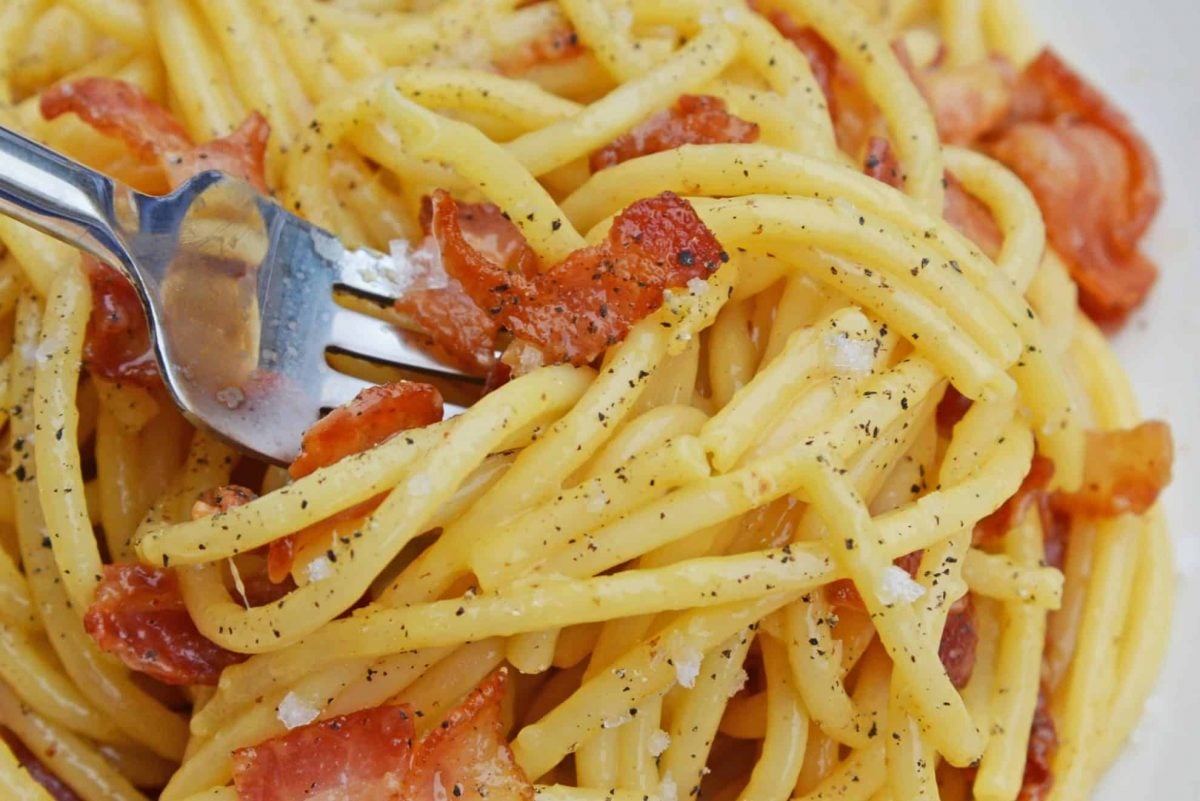 Close up of Authentic Carbonara on a fork 