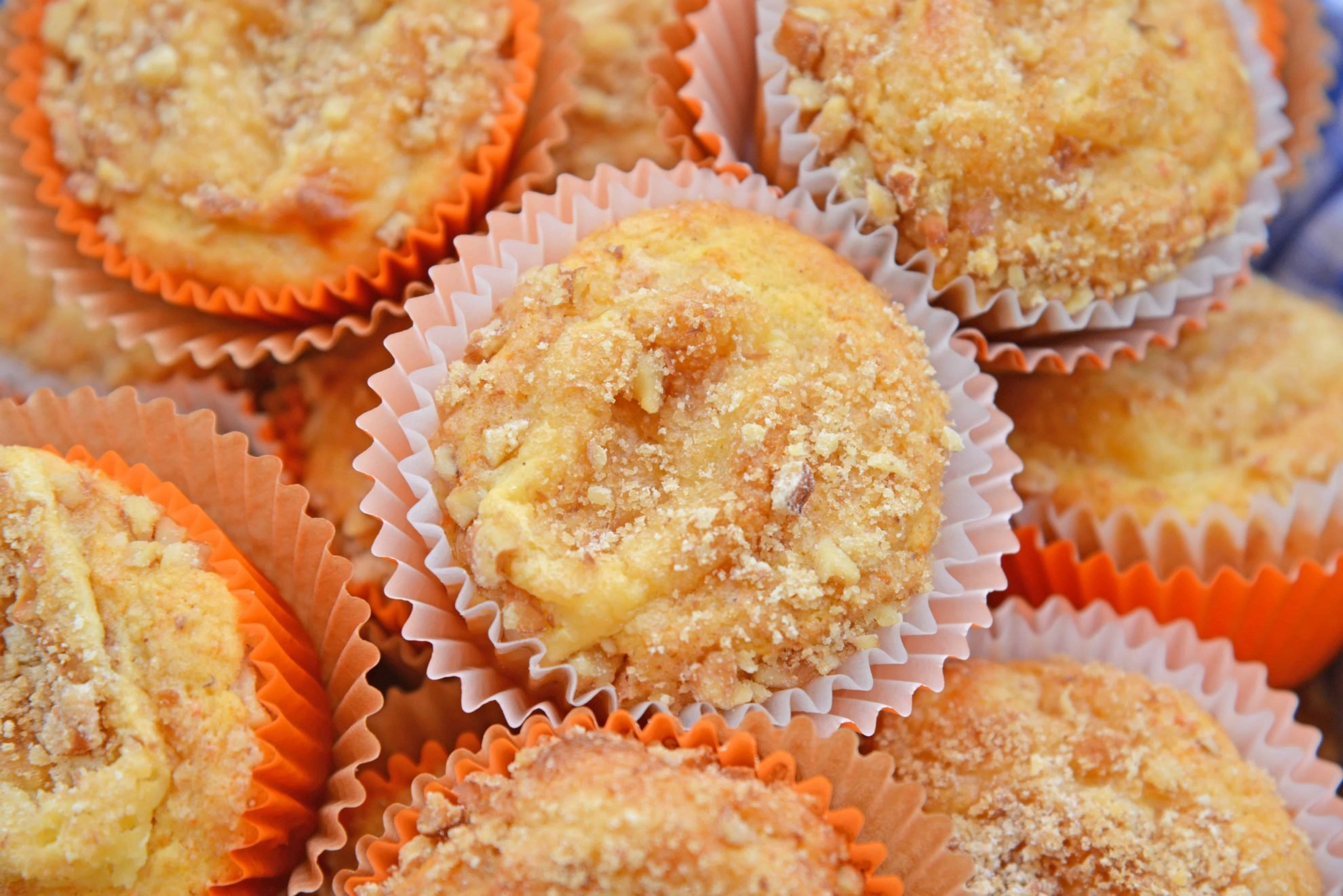 Carrot Cake Muffins are muffins loaded with carrots and stuffed with cream cheese frosting. Perfect for breakfast, brunch or a snack. Also freezer-friendly!  #carrotcakemuffins www.savoryexperiments.com 