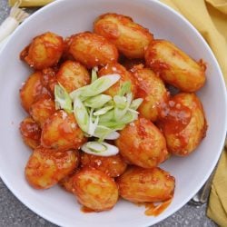 Chile Garlic Potatoes are an easy potato side dish using baby potatoes in a sweet and spicy sauce. #potatosidedish www.savoryexperiments.com