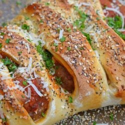 Everything Meatball Stromboli is meatballs, marinara sauce and cheese wrapped in pizza dough topped with everything bagel seasoning. An easy weeknight meal recipe! #howtomakestromboli #strombolirecipe #meatballstromboli www.savoryexperiments.com