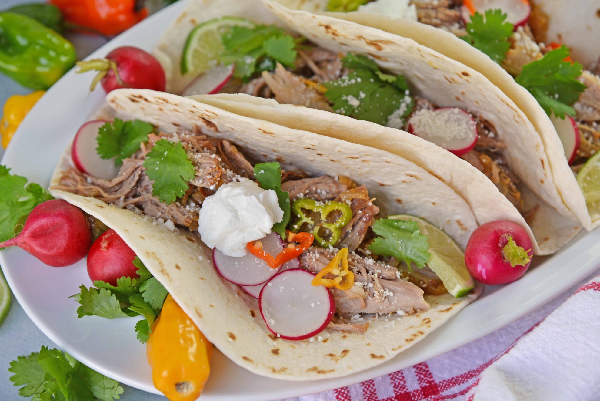 Pressure Cooker Carnitas are an easy pressure cooker recipe for shredded pork with Mexican flavors. Perfect for making the perfect soft taco! #pressurecookercarnitas #instantpotcarnitas #easycarnitas www.savoryexperiments.com