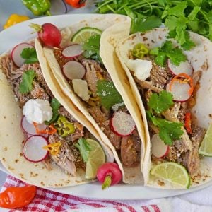 Pressure Cooker Carnitas are an easy pressure cooker recipe for shredded pork with Mexican flavors. Perfect for making the perfect soft taco! #pressurecookercarnitas #instantpotcarnitas #easycarnitas www.savoryexperiments.com