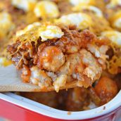 Sloppy Joe Tater Tot Casserole combines layers of crispy tater tots with homemade sloppy Joe mix, cream cheese and cheddar for the ultimate quick meal or party food! #tatertotcasserole #sloppyjoes www.savoryexperiments.com