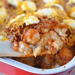 Sloppy Joe Tater Tot Casserole combines layers of crispy tater tots with homemade sloppy Joe mix, cream cheese and cheddar for the ultimate quick meal or party food! #tatertotcasserole #sloppyjoes www.savoryexperiments.com