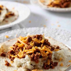 angled shot of chorizo breakfast taco on plate