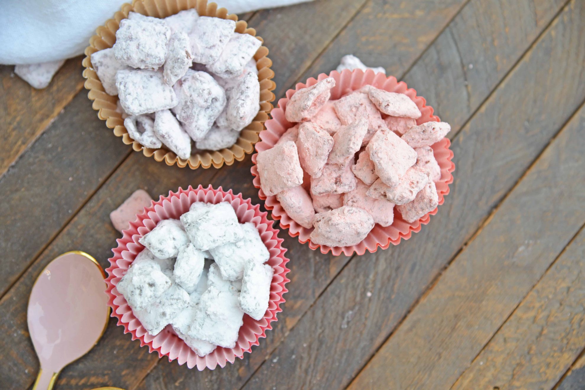 Valentine's Day Puppy Chow transforms a traditional muddy buddy recipe into a festive Cupid Crunch mix! The perfect no-bake dessert for any Valentine's Day party. #puppychow #valentinesdaydesserts #muddybuddy #nobakedesserts www.savoryexperiments.com