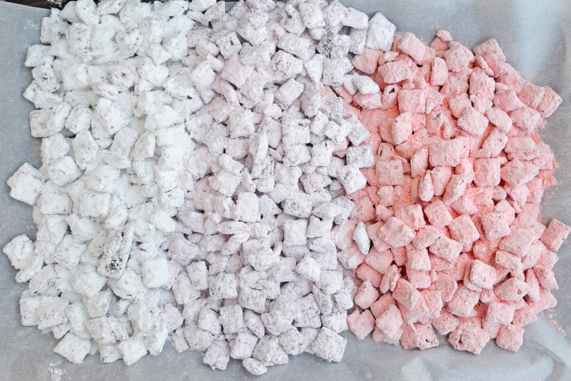 Valentine's Day Puppy Chow transforms a traditional muddy buddy recipe into a festive Cupid Crunch mix! The perfect no-bake dessert for any Valentine's Day party. #puppychow #valentinesdaydesserts #muddybuddy #nobakedesserts www.savoryexperiments.com