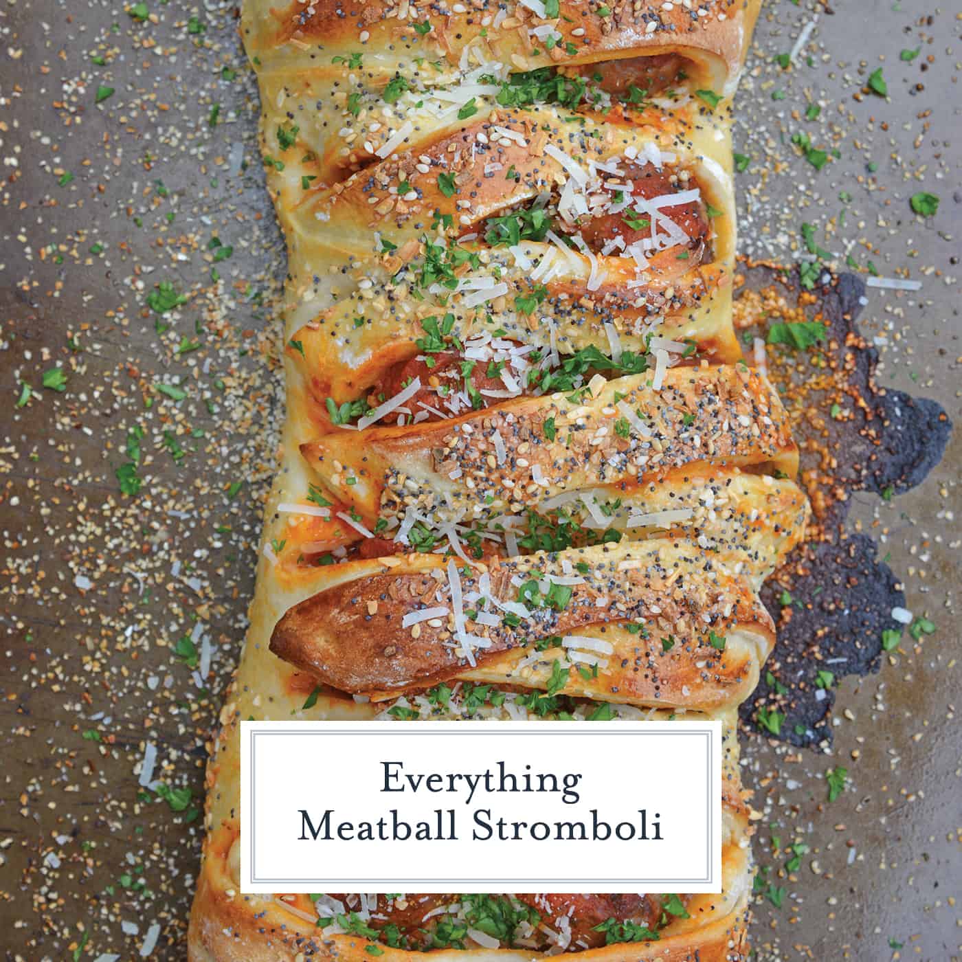 Everything Meatball Stromboli is meatballs, marinara sauce and cheese wrapped in pizza dough topped with everything bagel seasoning. An easy weeknight meal recipe! #howtomakestromboli #strombolirecipe #meatballstromboli www.savoryexperiments.com 